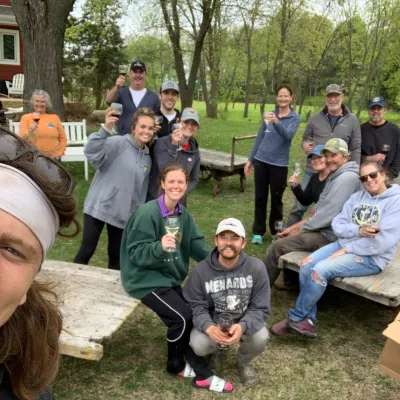 a group of people sitting at a park