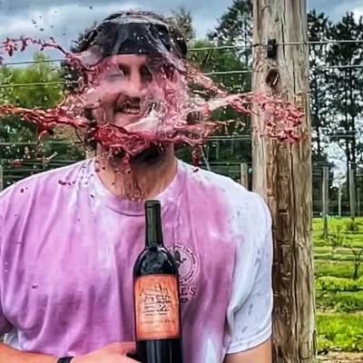 a person holding a wine glass