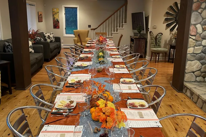 a group of people sitting at a table in a restaurant