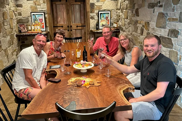 a group of people sitting at a table in a restaurant