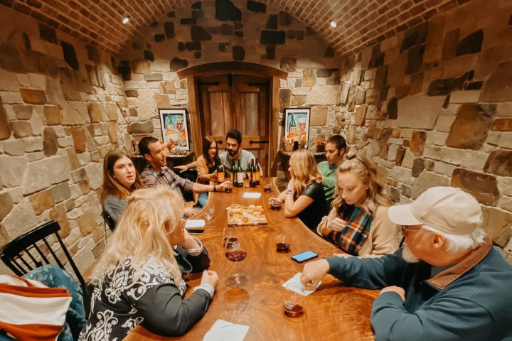 a group of people sitting at a table