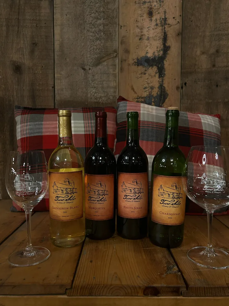 a bottle and a glass of wine